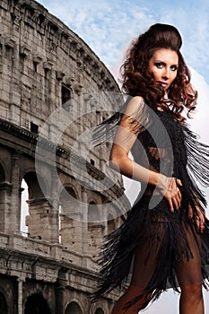 Woman dancing on with a coliseum on a background