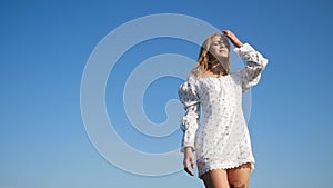 Woman Dancing Enjoying Sunlight Against Sky