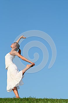 Woman dancing on grass