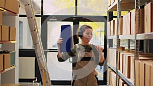 Woman dancing holding inventory list