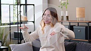 Woman Dancing At Home During Weekend Leisure