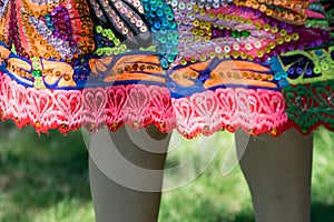 Woman dancing Huayno dance on white background