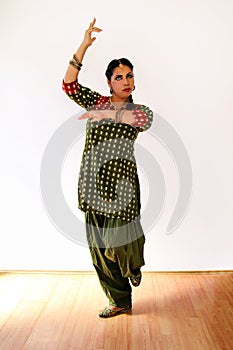 Woman dancing Indian dance in national dress. Shree kurta.