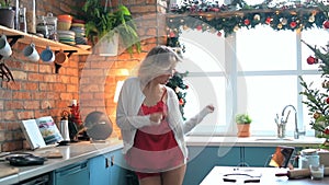 Woman dancing in the kitchen