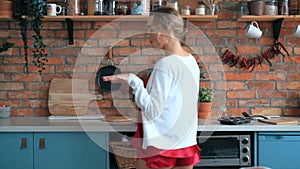 Woman dancing in the kitchen