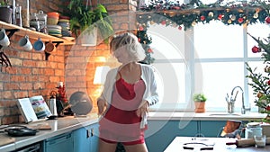 Woman dancing in the kitchen