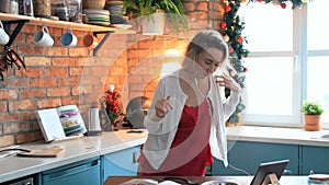 Woman dancing in the kitchen