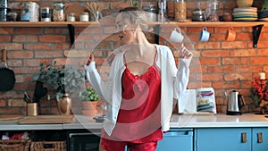 Woman dancing in the kitchen