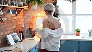 Woman dancing in the kitchen