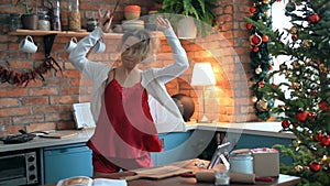Woman dancing in the kitchen