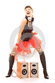 Woman dancing near speakers with pleasure