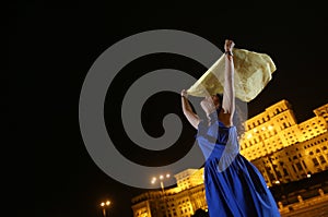 Woman dancing in the night city view