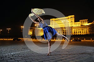 Woman dancing in the night city view