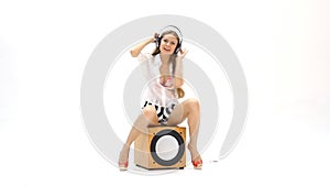Woman dancing on the subwoofer