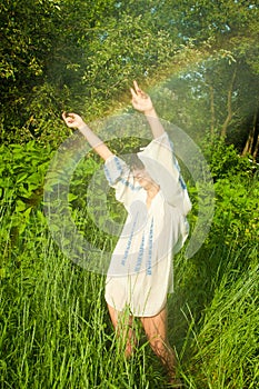 Woman dancing in summer rain