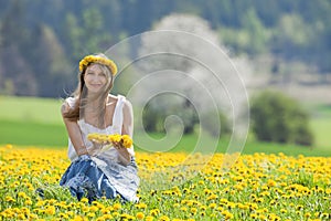 Woman in a dandelion field