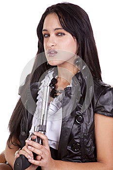 Woman dark hair holding gun up