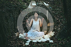 Woman in dark wood surrounded by books