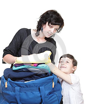 Woman and daughter hand crammed full of clothes and shoulder bag