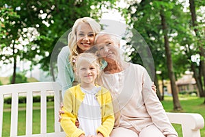 Woman with daughter and senior mother at park