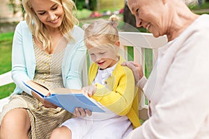 Woman with daughter and senior mother at park