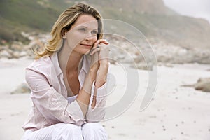 Woman Daydreaming At Beach