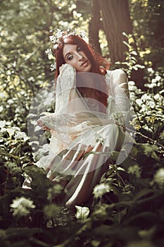 Woman daydreaming in a forest