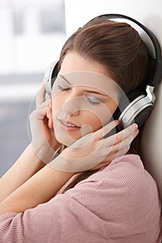 Woman daydreaming with headphone