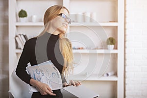 Woman daydreaming in office