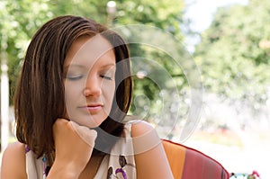 Woman daydreaming in peaceful garden