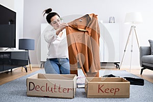 Woman Decluttering Clothes, Sorting