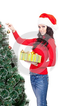 Woman decorating artifical fur tree