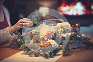 Woman decorating christmas table