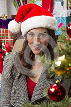 Woman decorating Christmas tree.