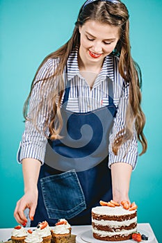 Woman decorating delicious cake