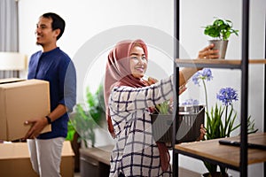 woman decorating her new home after moving in