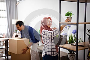 woman decorating her new home after moving in