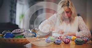 Woman decorating Traditional Easter Eggs Using Old Traditional Technique.