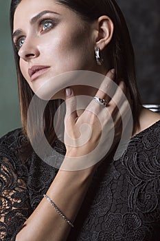 Woman Deep in Thought. Gold and Diamond Jewelry