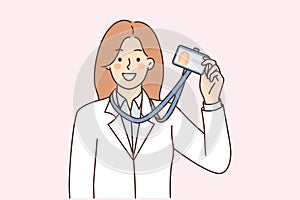 Woman demonstrate id card hanging around neck for identification and entry into science laboratory
