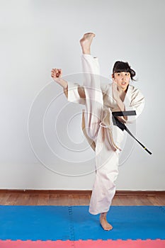 Woman demonstrate martial arts working together