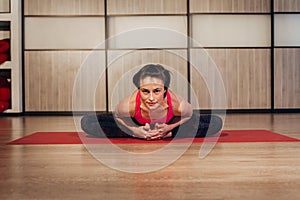 Woman demonstrating Sukhasana or Easy yoga pose