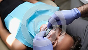 Woman with dental cast veneer on upper jaw in dentistry
