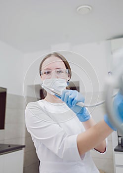 Woman dentist in the doctor`s office