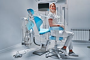 Woman dentist at her office smiling