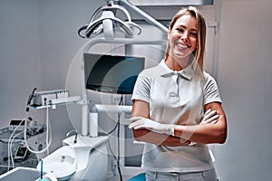 Woman dentist at her office smiling