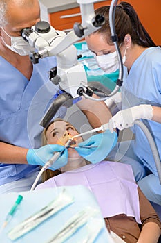 Woman at dentist surgery have treatment