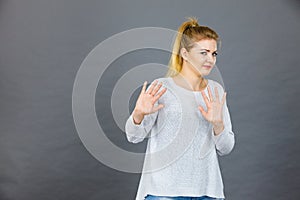 Woman deny something showing stop gesture with hands