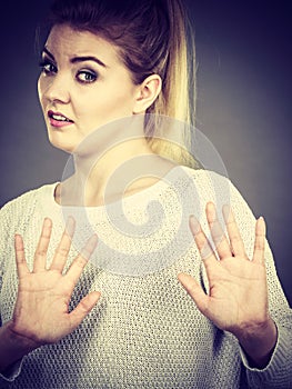 Woman deny something showing stop gesture with hands