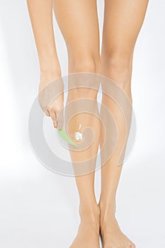 Woman depilate her legs photo